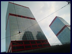 Shun Tak Centre from 1986 with its significant red striped twin towers, 145m tall each. A shopping mall, a large parking garage and the Macau ferry terminal can be found inside the complex . 